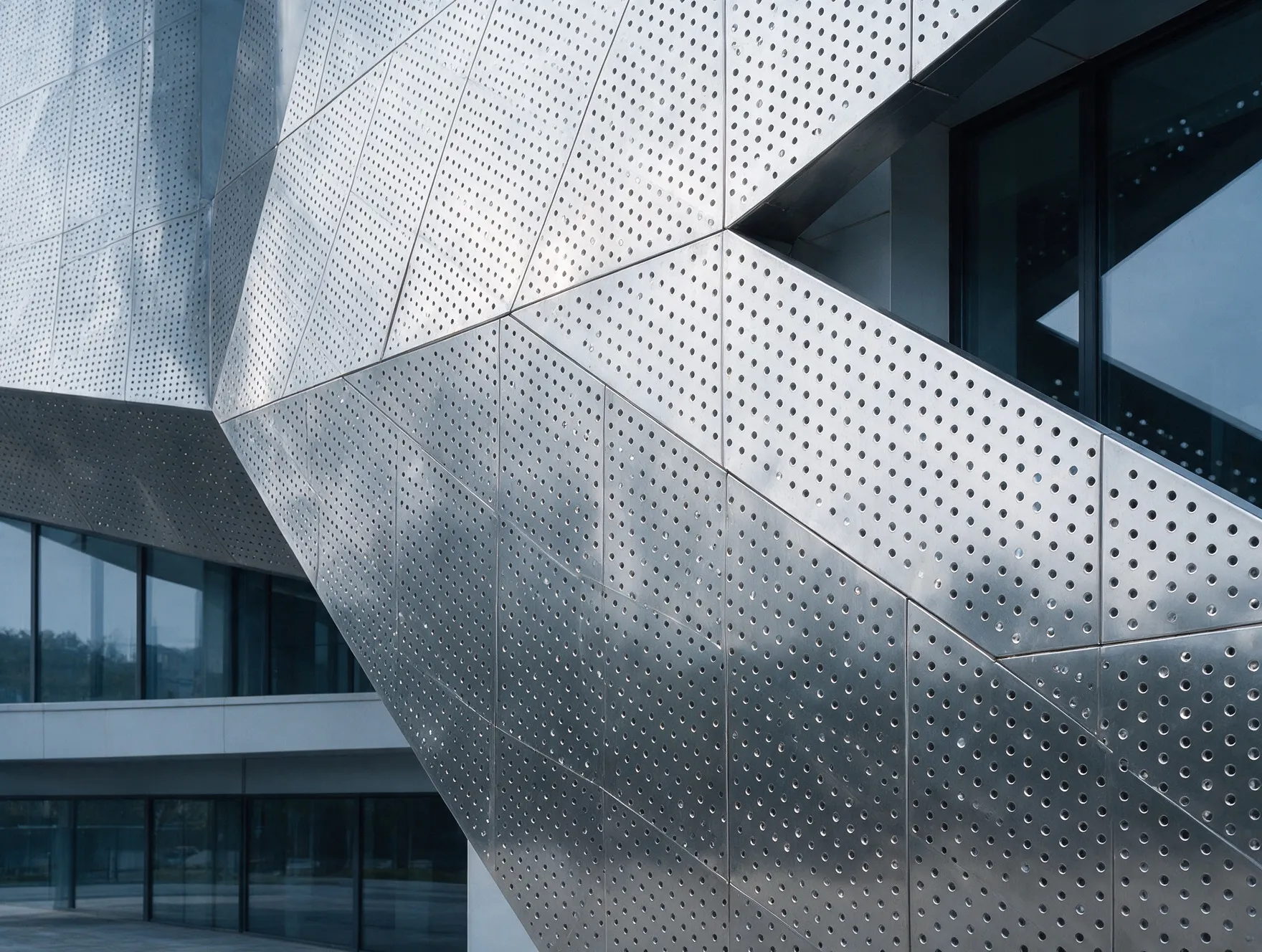 Perforated stainless steel panels cladding a building facade